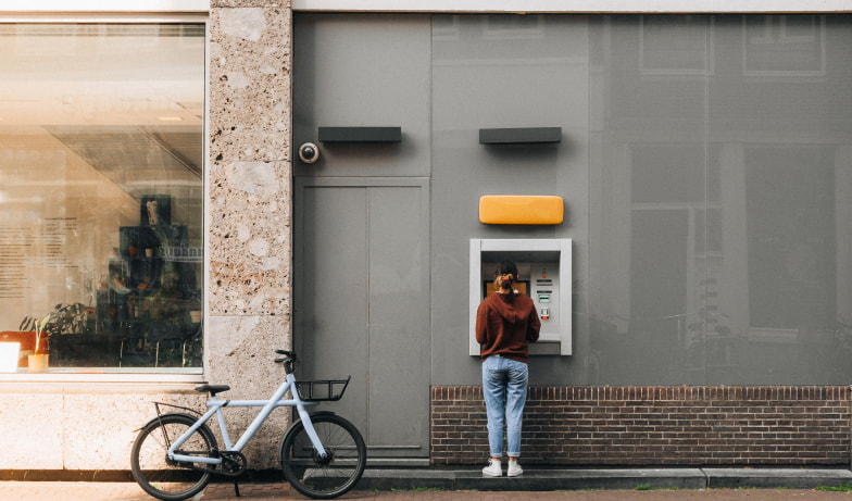 A person using the ATM