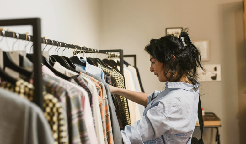 Woman picking out clothing